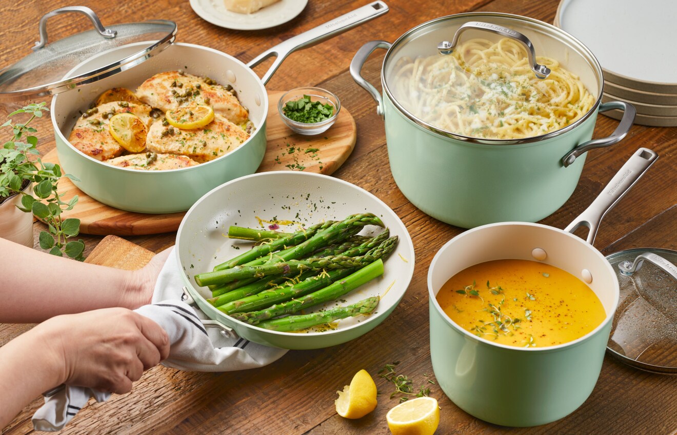 Person preparing a meal with KitchenAid® Ceramic Nonstick Cookware