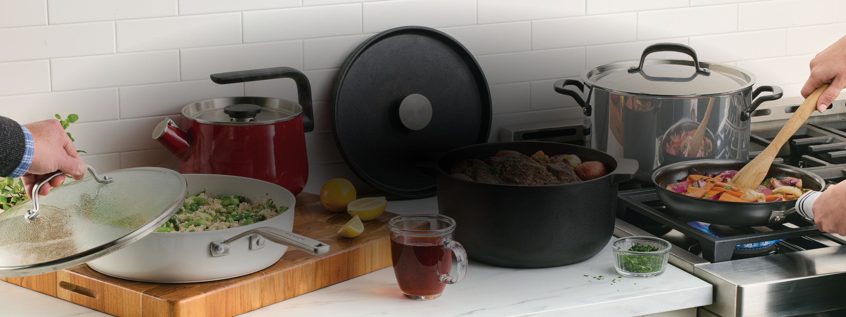 People preparing a meal with KitchenAid® Cookware