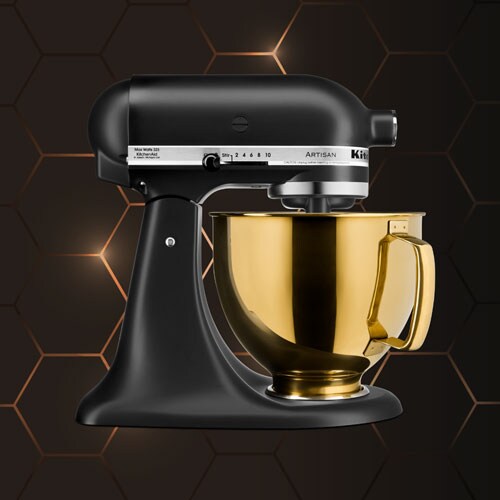 Black Stand Mixer in front of dark honeycomb textured background