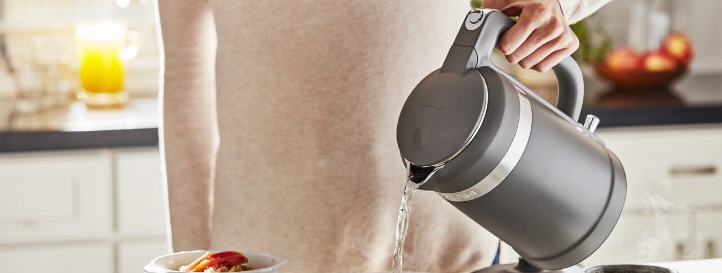 Person pouring from a kettle Person pouring from a kettle