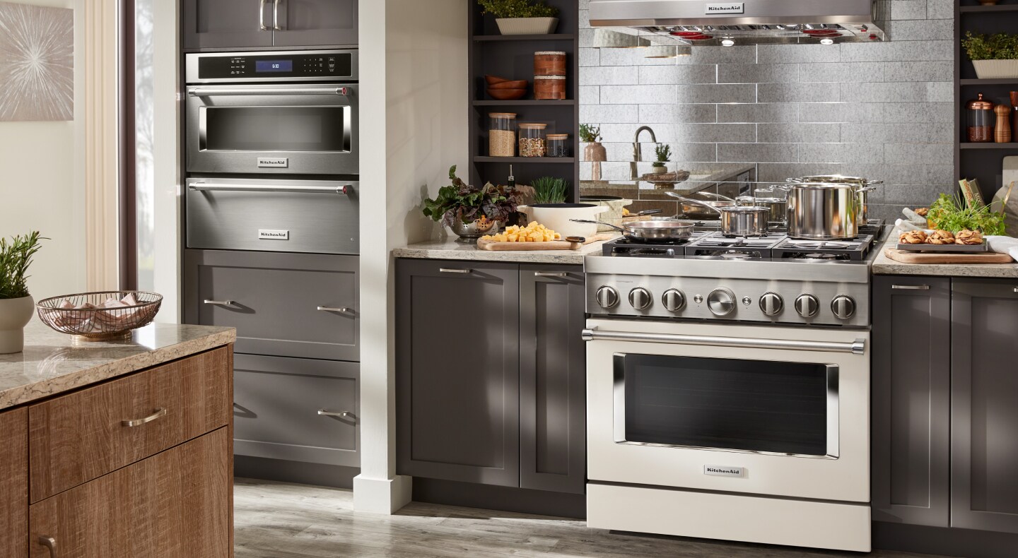 View of wall oven, stove and hood
