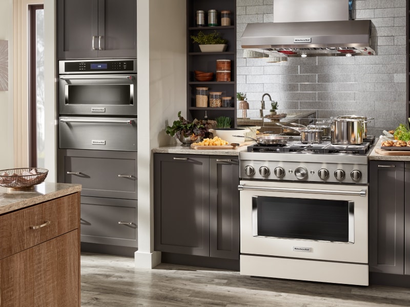 View of wall oven, stove and hood View of wall oven, stove and hood