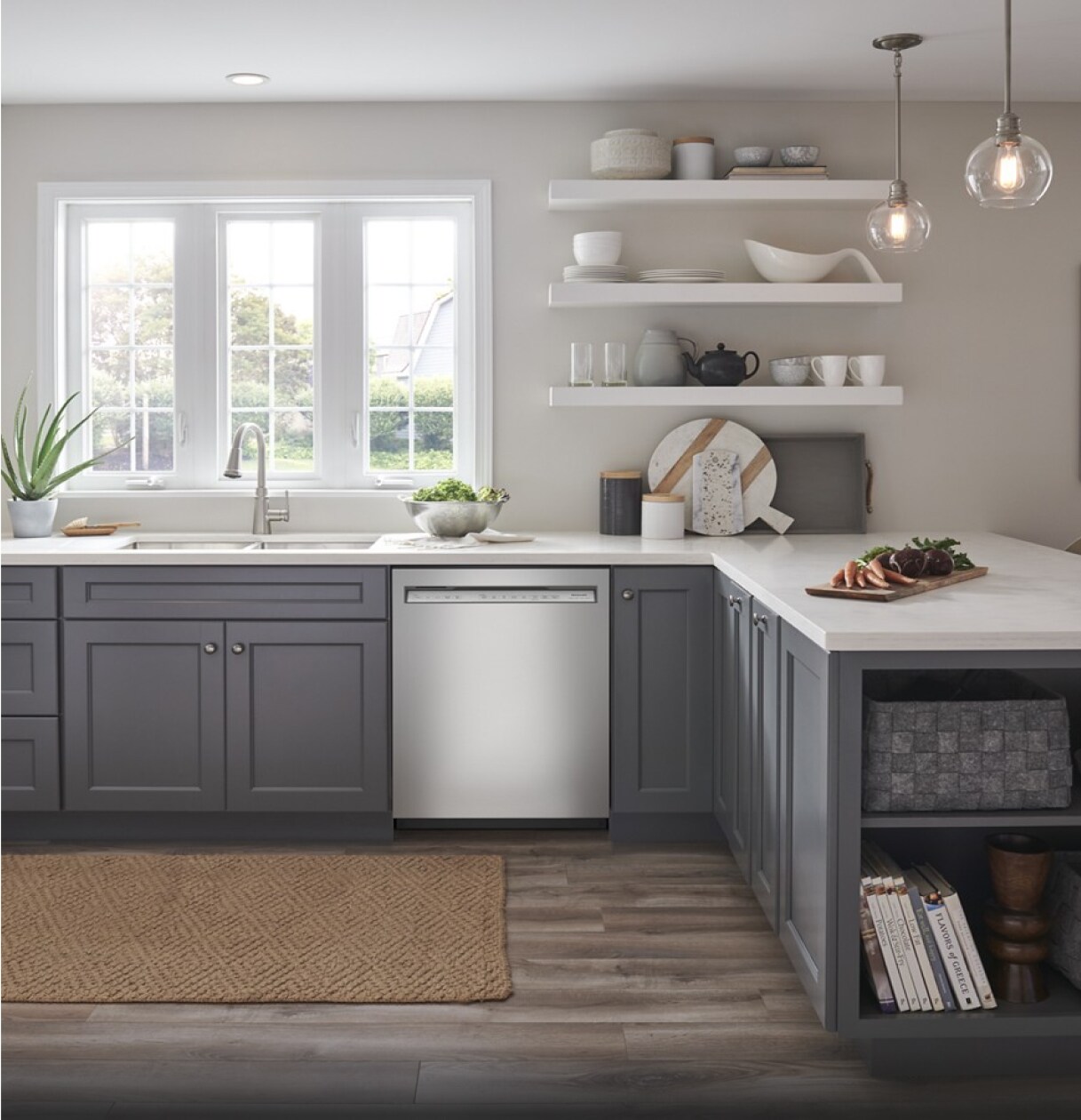 A bright, light kitchen with stainless steel appliances