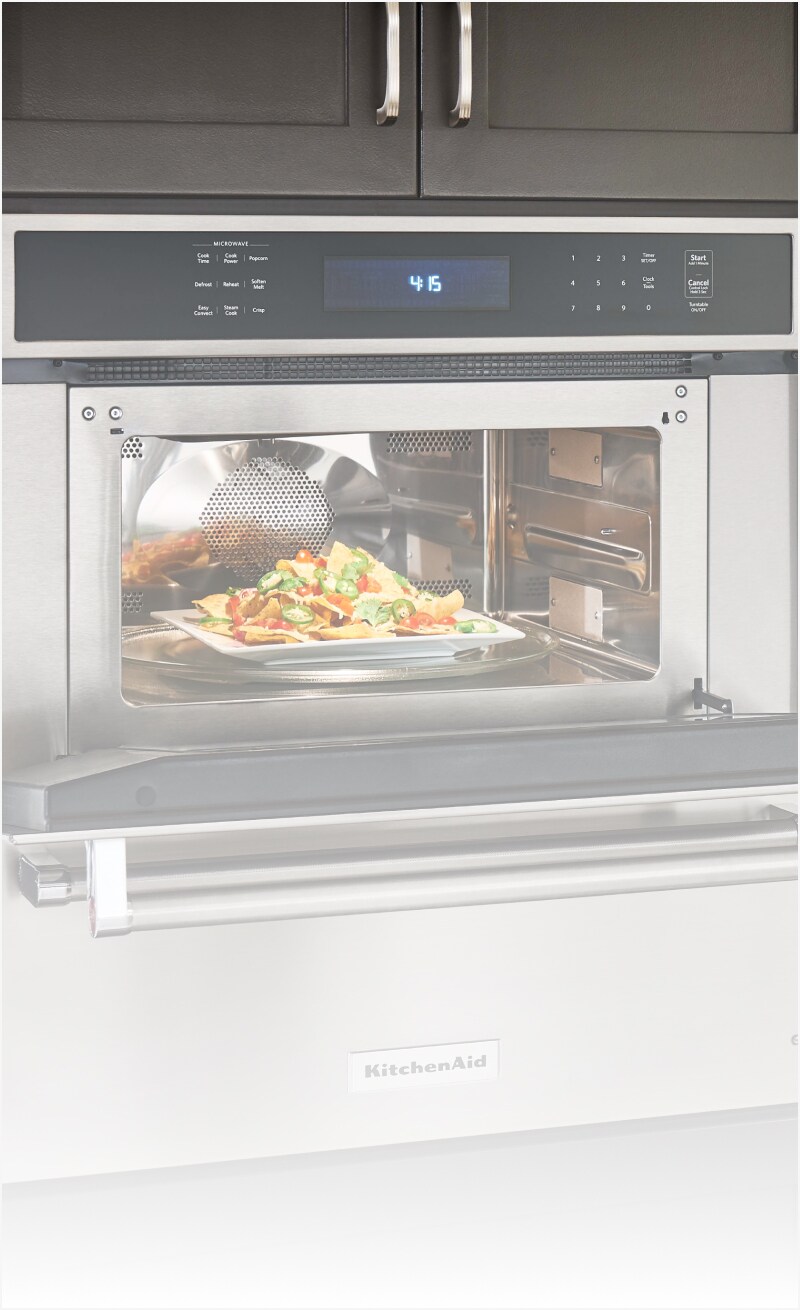 An open microwave with food inside