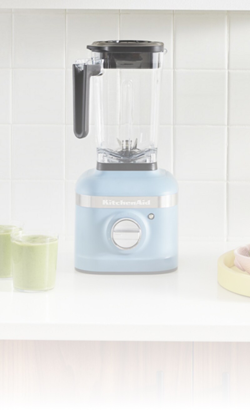 Woman standing in front of an open refrigerator