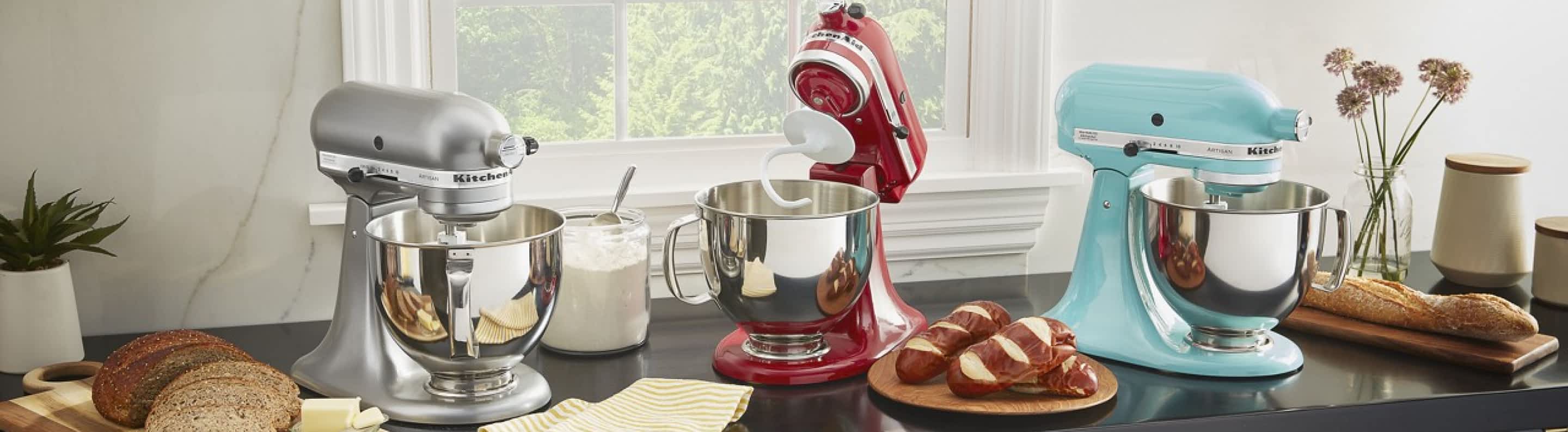 A collection of KitchenAid® Stand Mixers on a countertop.