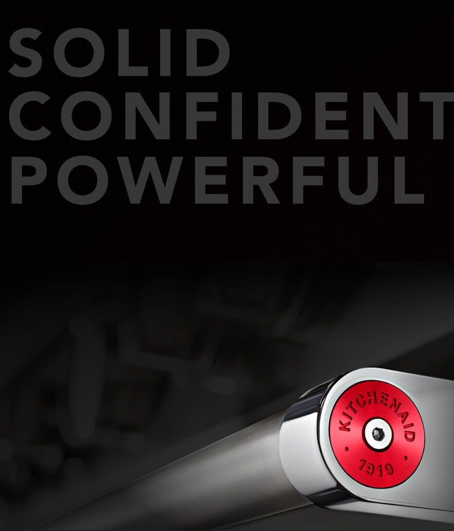 Range handle with red medallion.