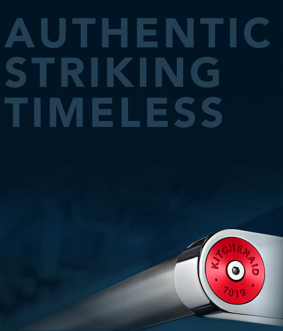 Range handle with red medallion.