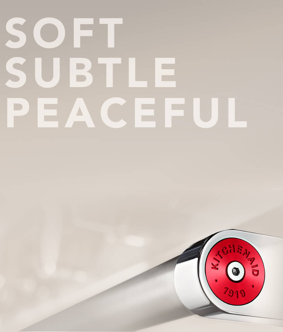 Range handle with red medallion.