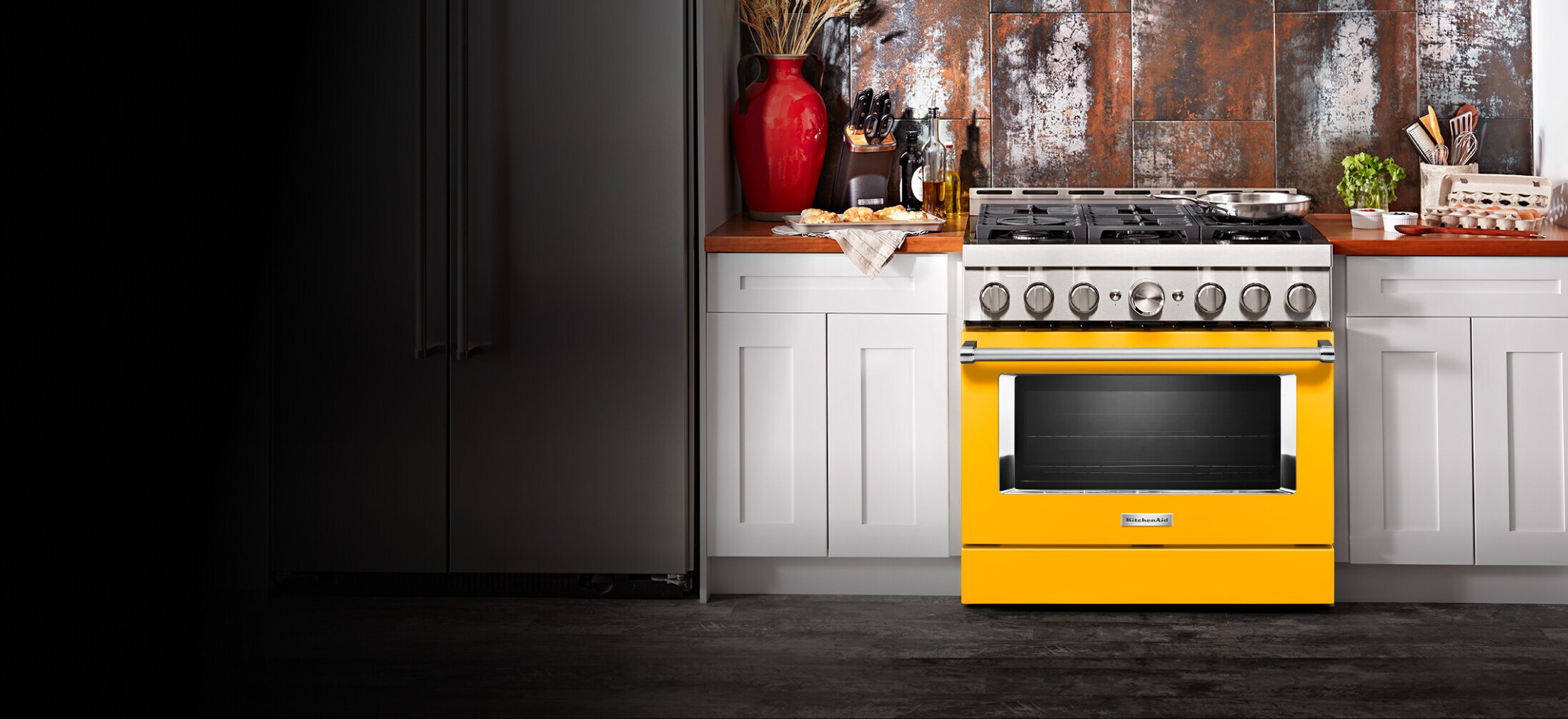 Kitchen with yellow pepper range. 