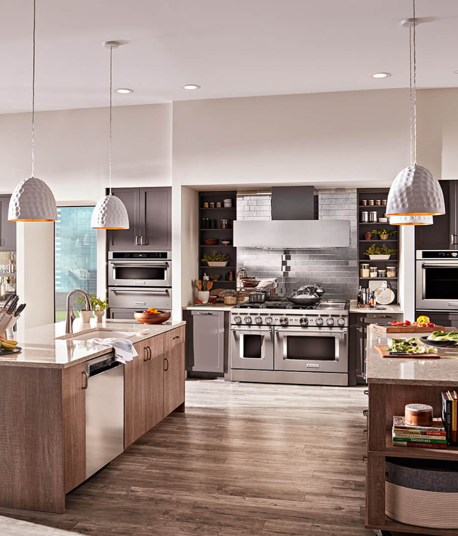 Kitchen equipped with a stainless steel range. 