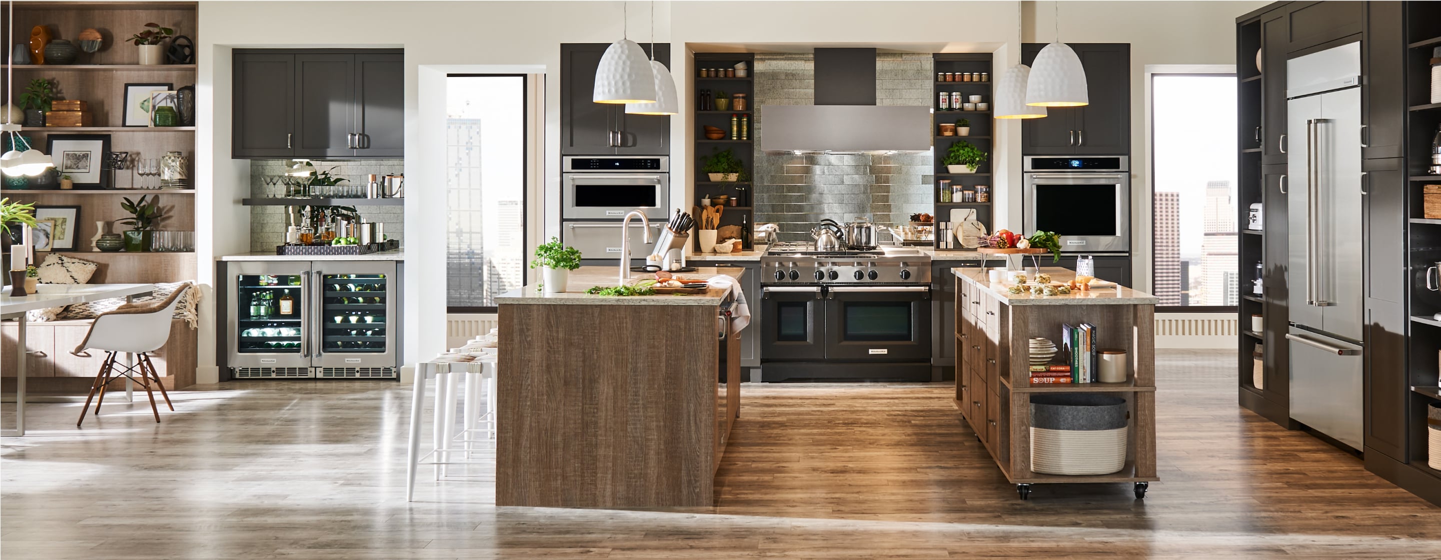 A large, open-concept kitchen, filled with built-in KitchenAid® appliances.