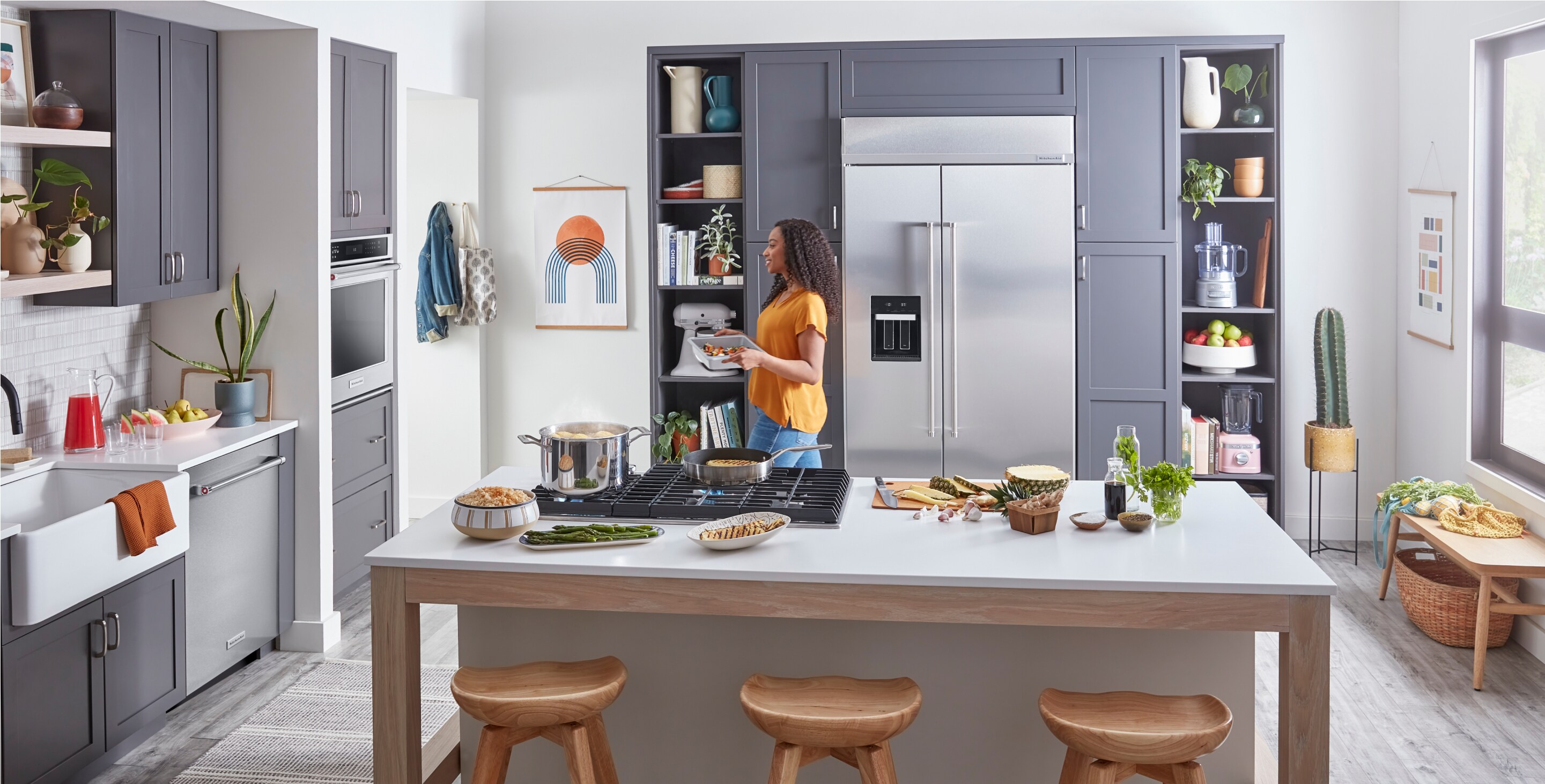 A sleek, modern kitchen filled with built-in KitchenAid® appliances. 