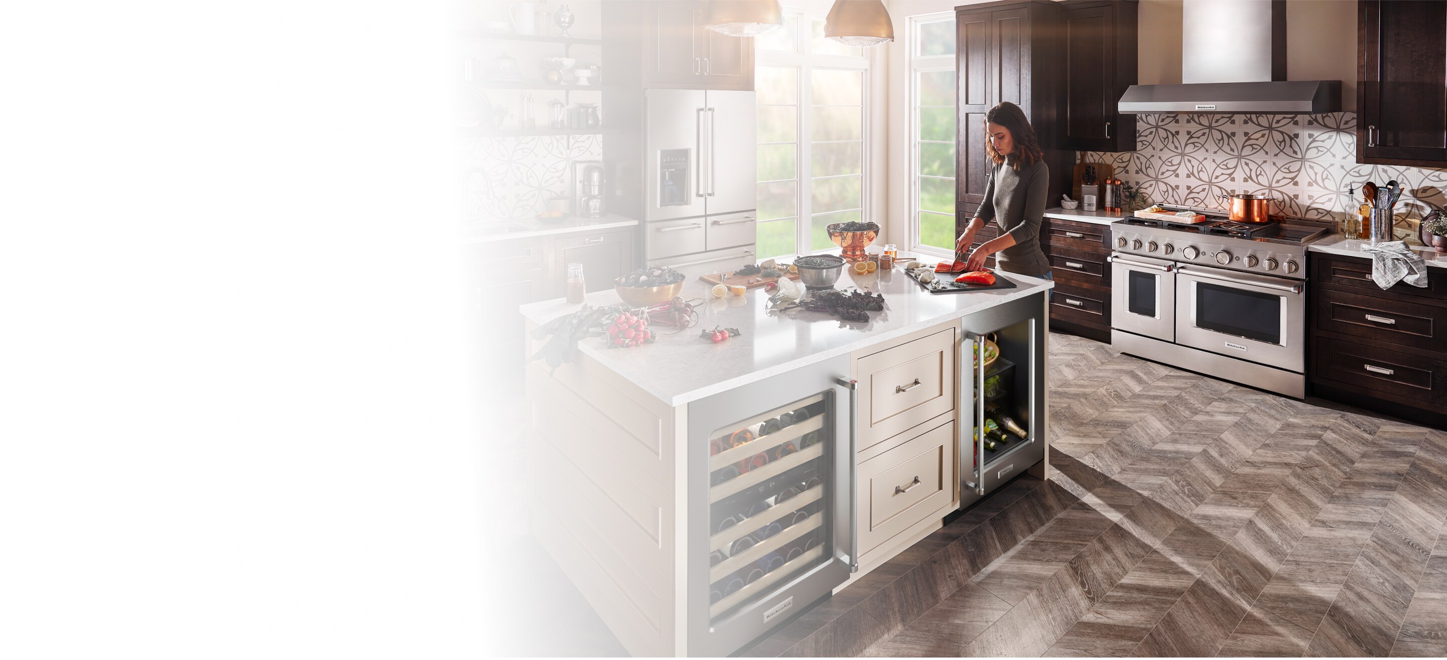 Person cutting food at a kitchen island