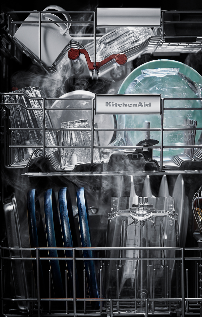 The interior of a loaded dishwasher.