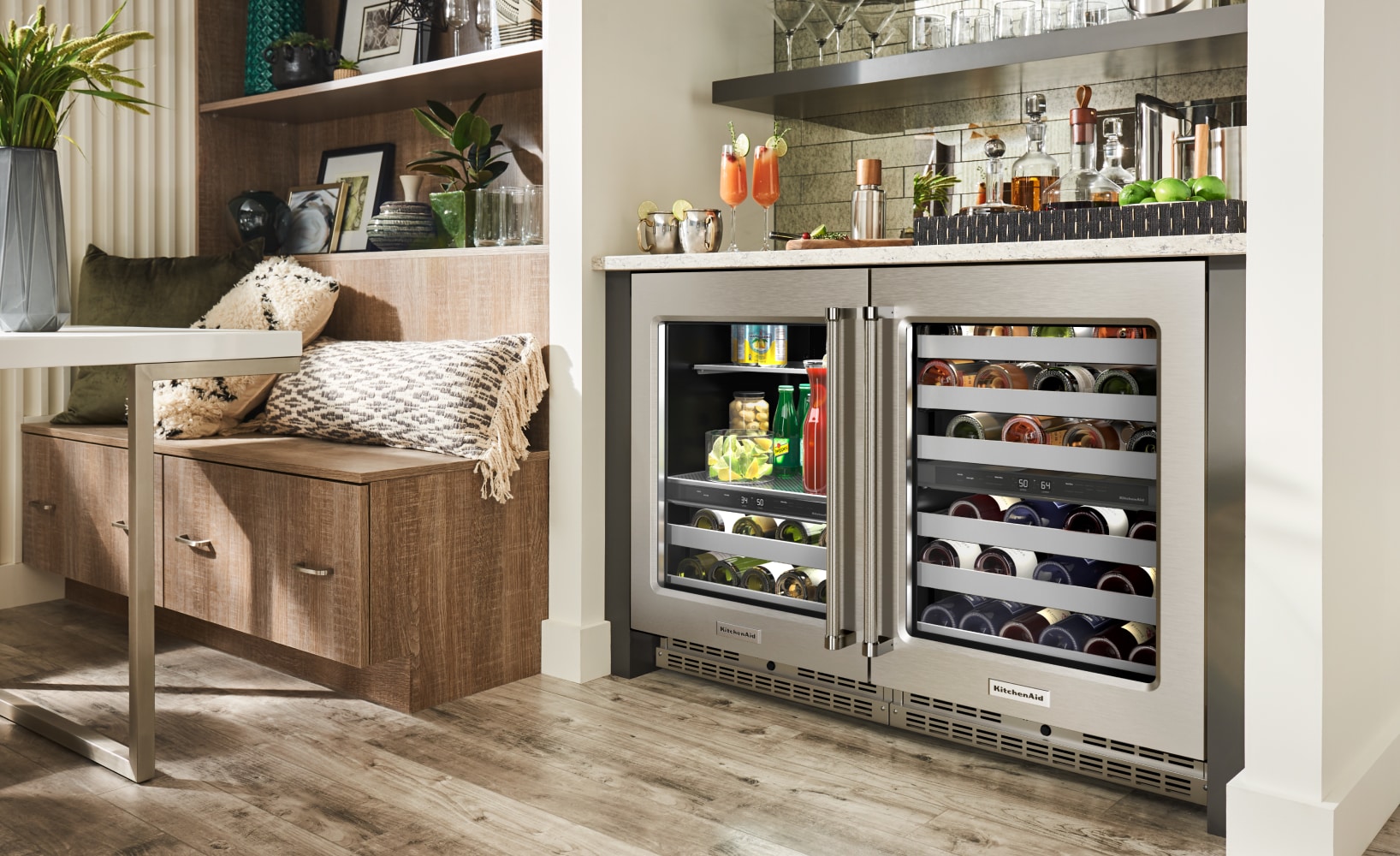 Fully stocked, side-by-side undercounter beverage center and wine cellar in a built-in bar and entertaining space.