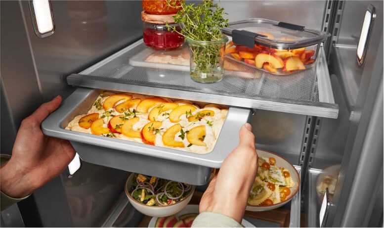 Placing cookware into Under-Shelf Prep Zone