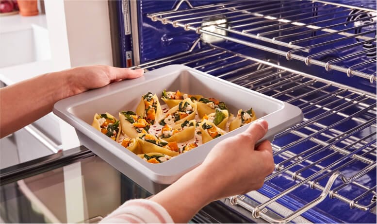 Placing cookware into oven