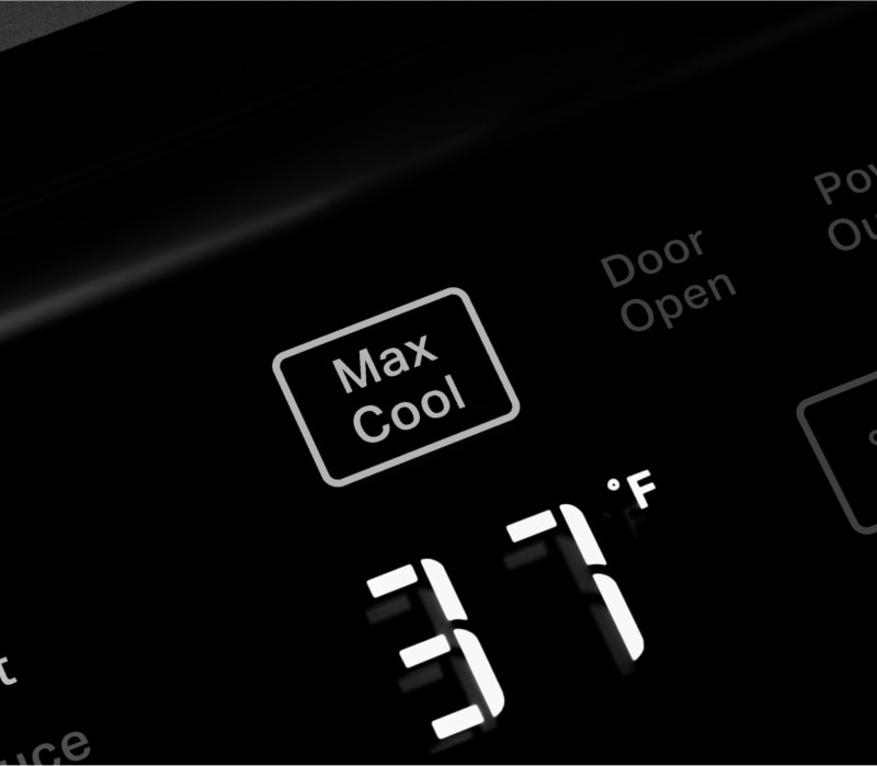 A person selecting the Max Cool control on the KitchenAid® Built-In Side-by-Side Refrigerator