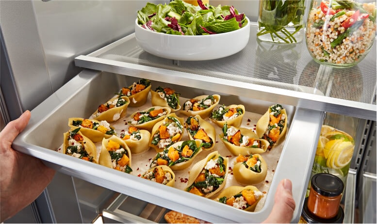 Placing cookware into Under-Shelf Prep Zone