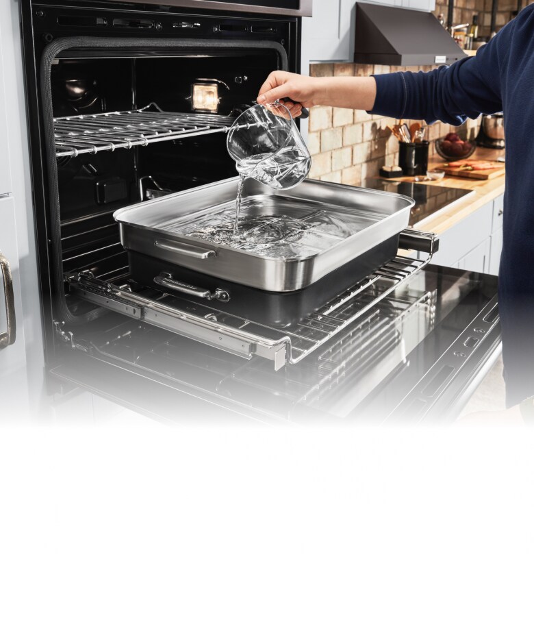 Filling a tray going into the oven.