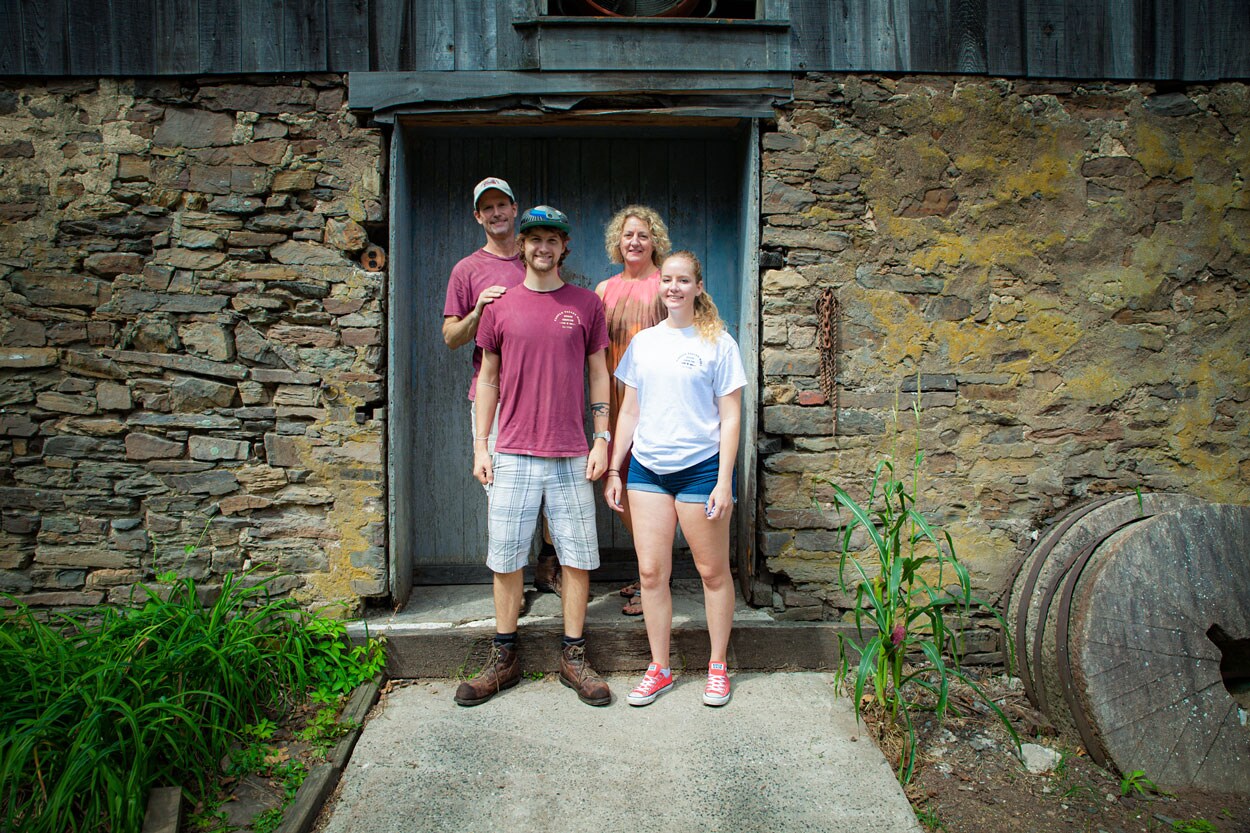 The Fischer family smiling together for a family photo.