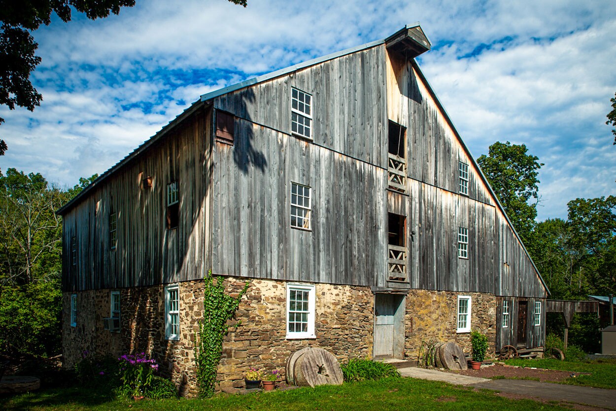 A family grain farm filled with early afternoon sun.
