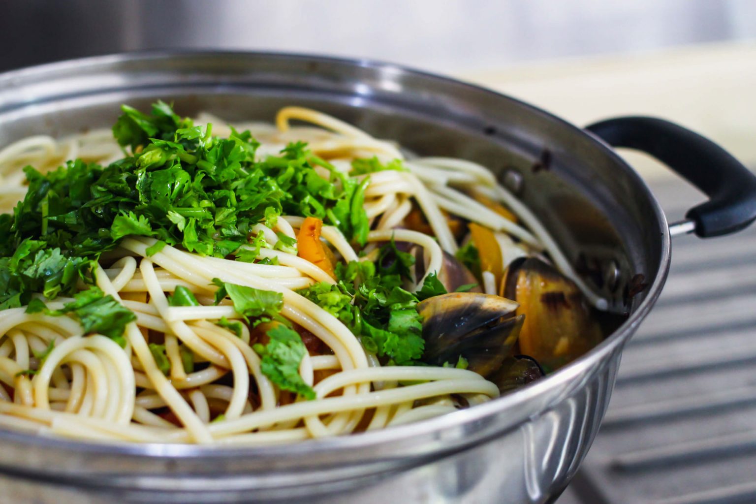 A large pot of cooked spaghetti.