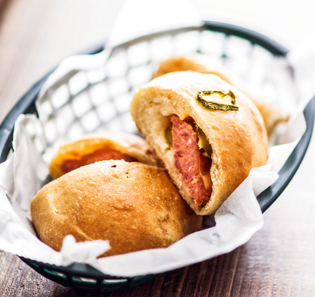 A basket of meat kolaches.