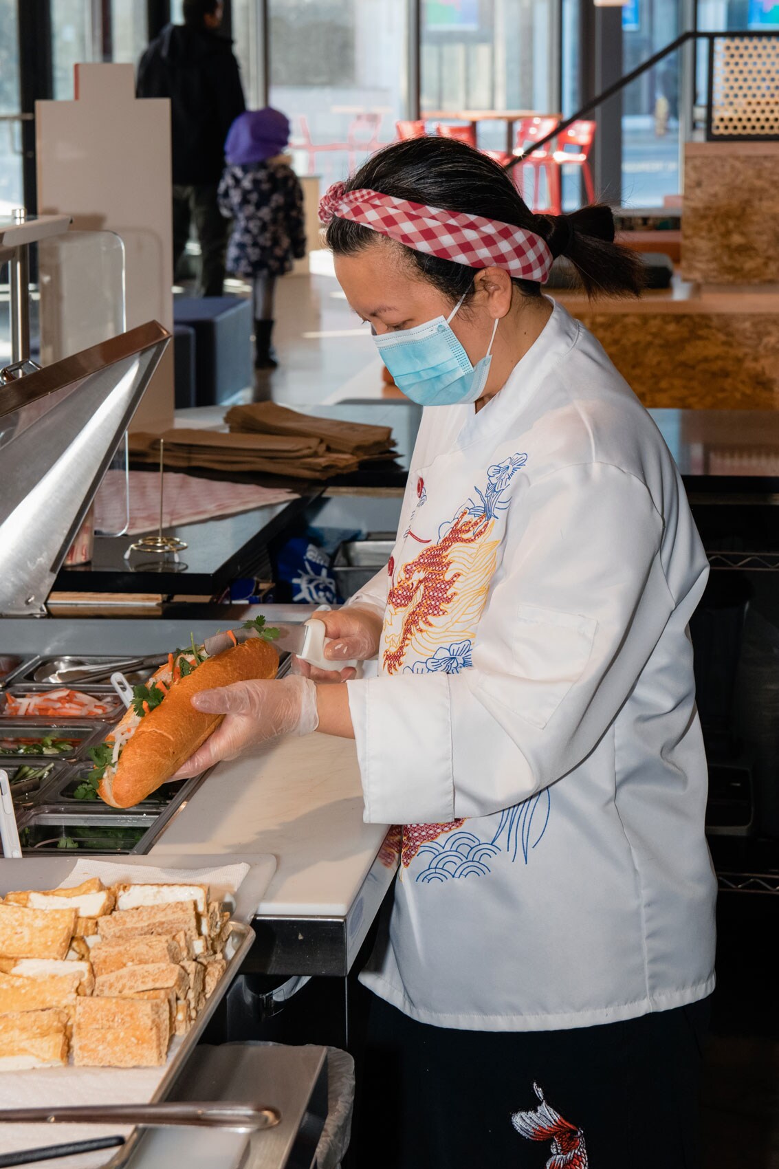 Ngoc making a large sandwich.