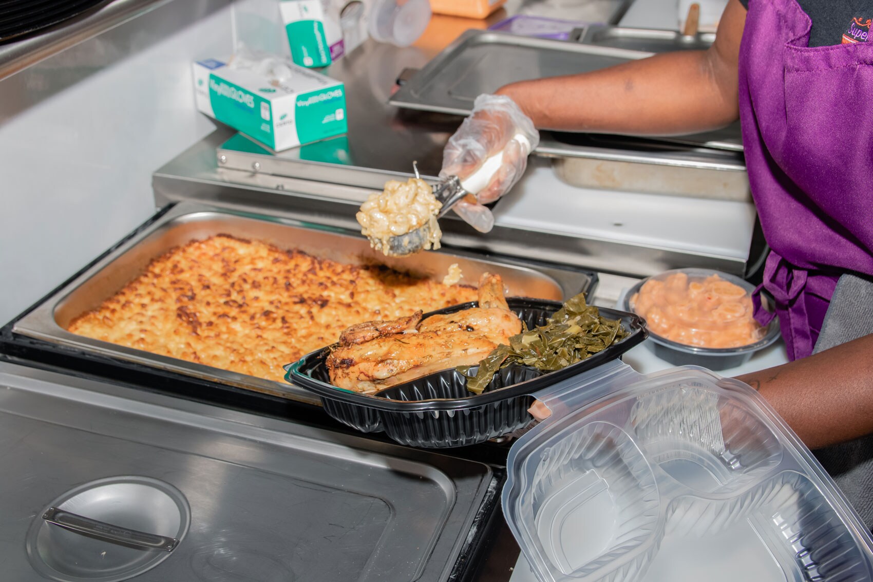 Dreamer serving a generous helping of mac and cheese.