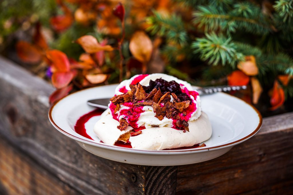 A pastry topped with beetroot sauce.