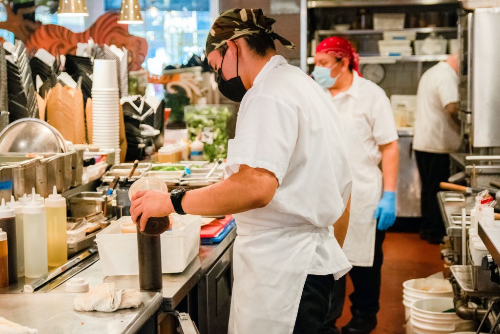 Chefs prepping take-and-make kits.