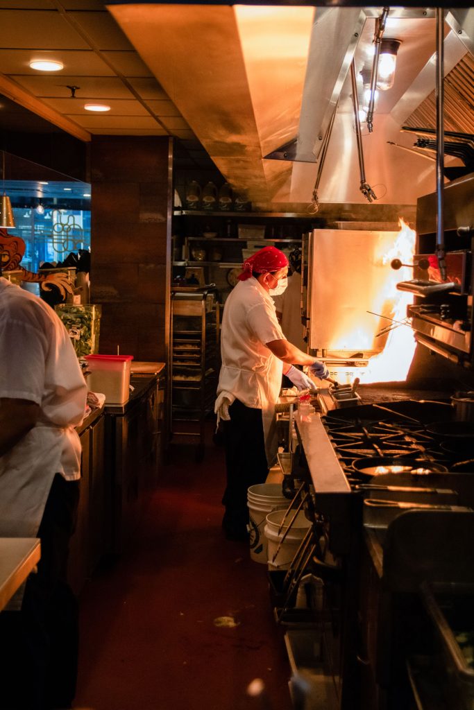 Chefs working in the restaurant kitchen of Myers + Chang.
