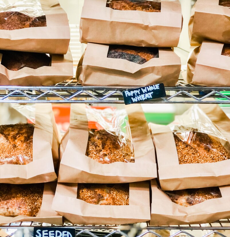 Paper-bagged breads on display.