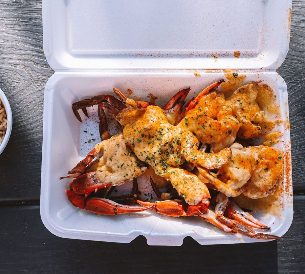 A metal tray topped with barbecue from Rodney Scott's BBQ.