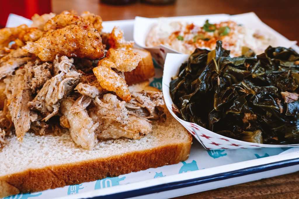 A metal tray topped with barbecue from Rodney Scott's BBQ.