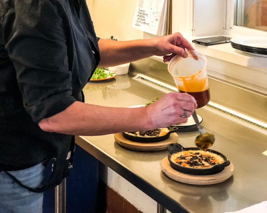 Chef McMurry plating food.