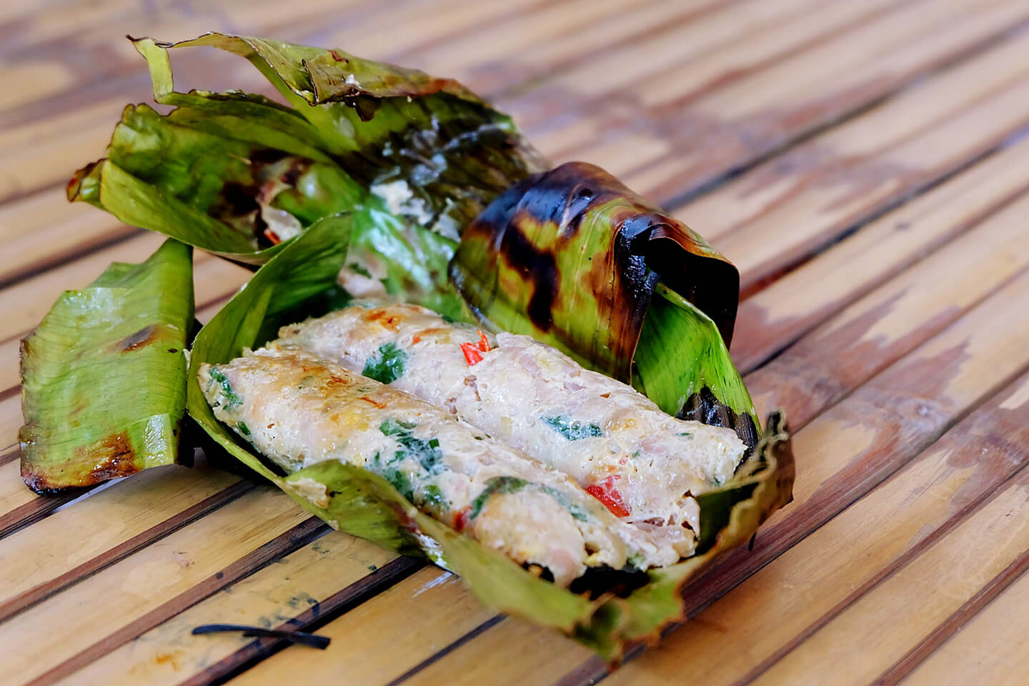 Freshly steamed chimaki unraveled on a table.