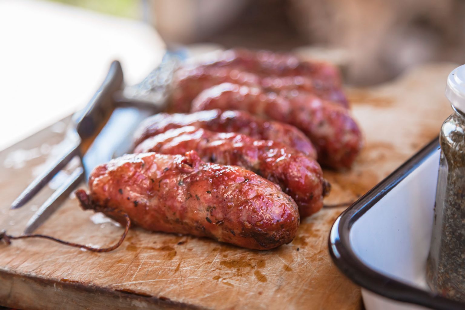 Grilled meat on a cutting board.