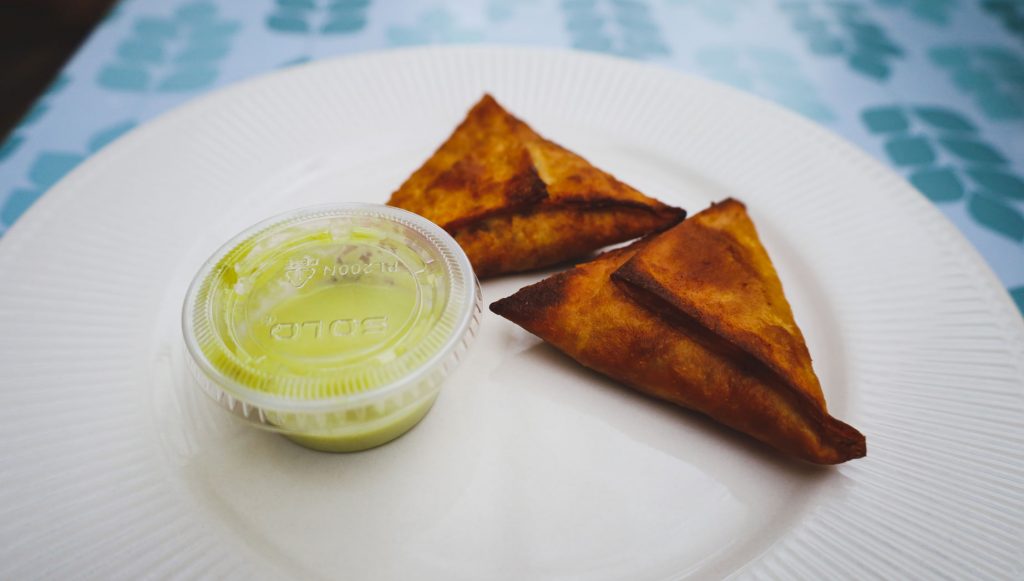 A closeup of plate of sambusa.