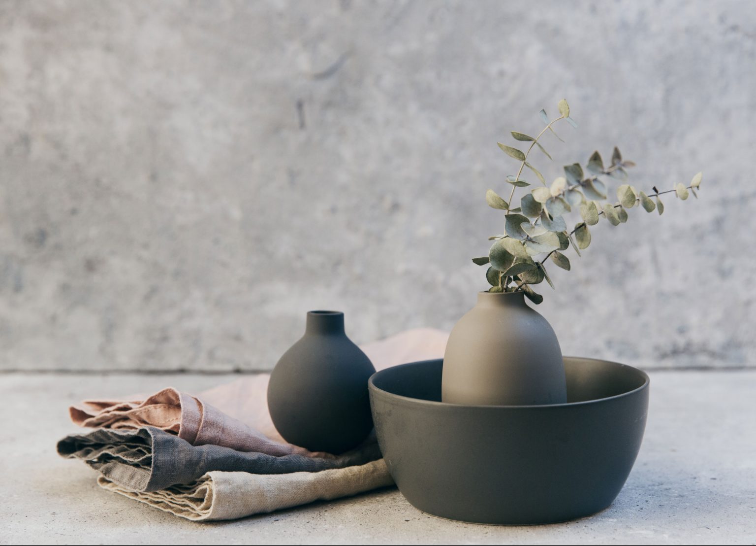 Pottery and linens in muted tones.