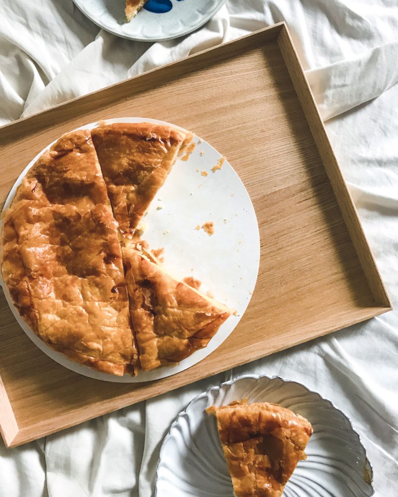 A galette des rois missing a few slices.