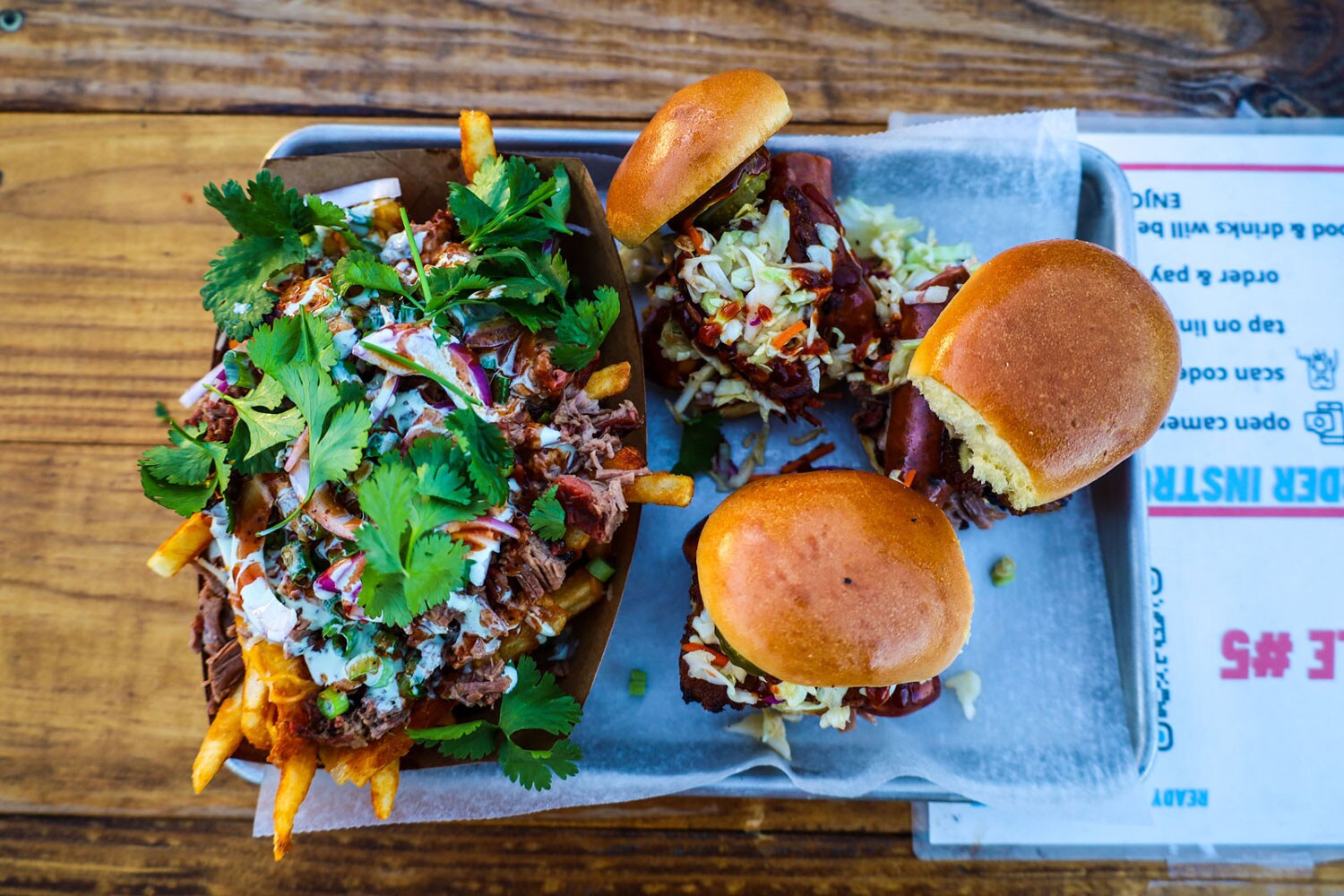 Loaded french fries and sandwiches.