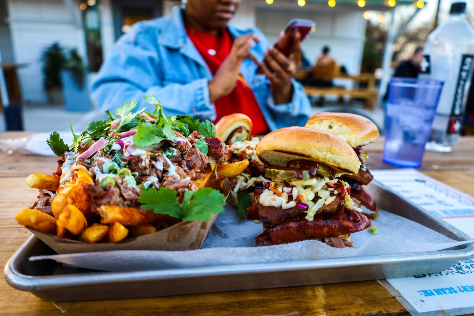 Loaded french fries and sandwiches.