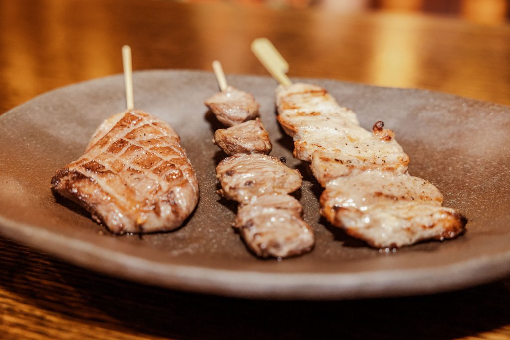 Skewers of cooked meat.