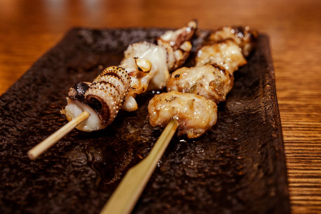 Skewers of cooked octopus.