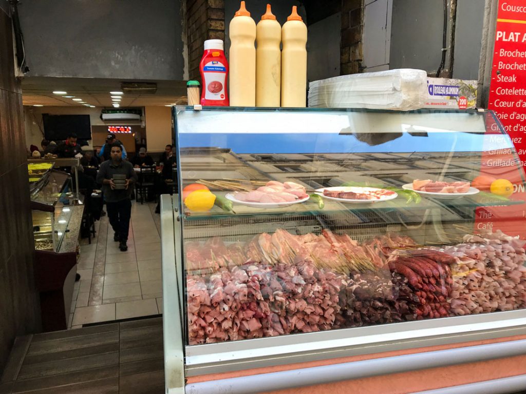 Meats sold at a storefront.