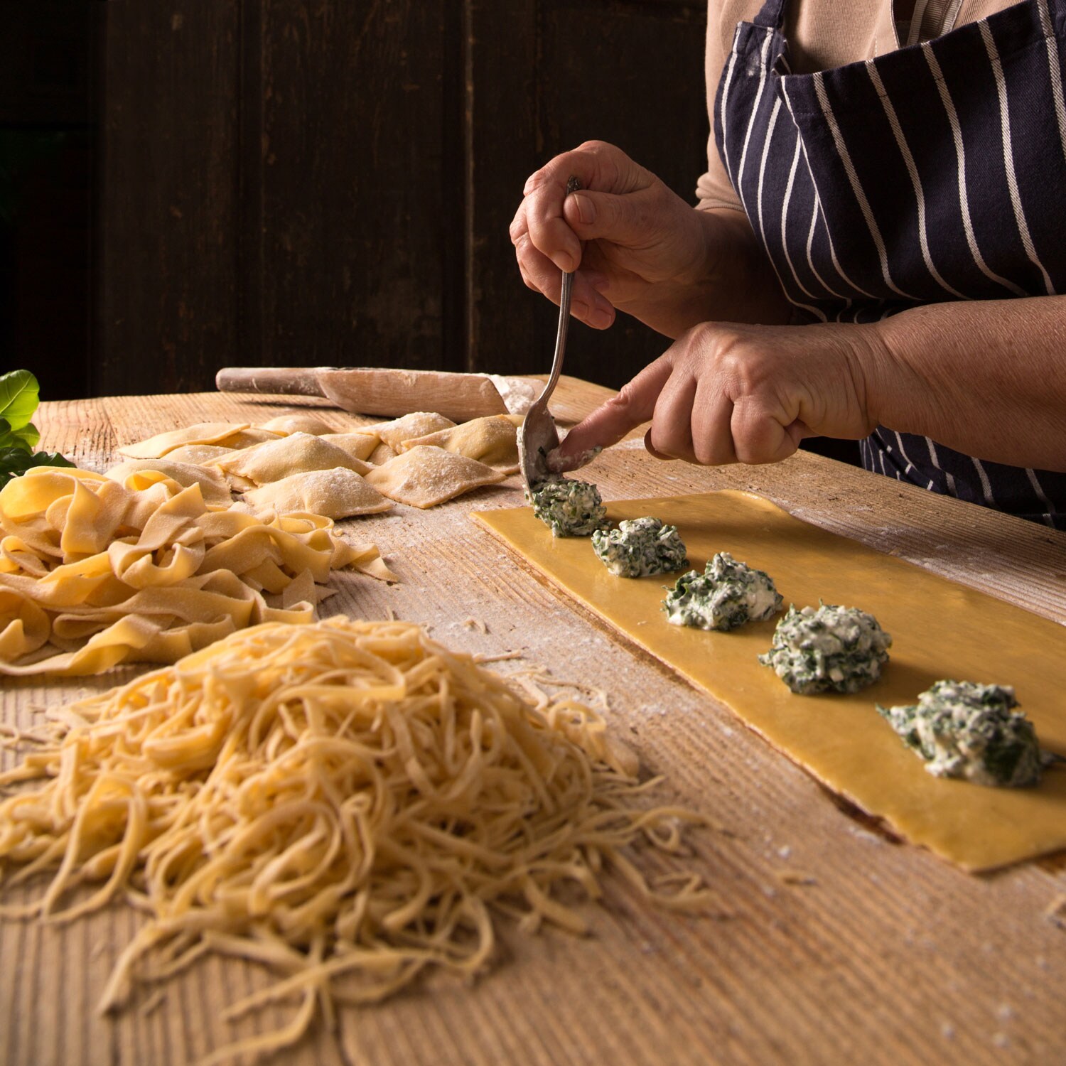 A person making pasta.