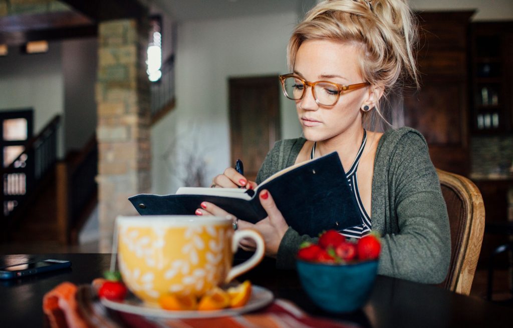 A person writing notes.